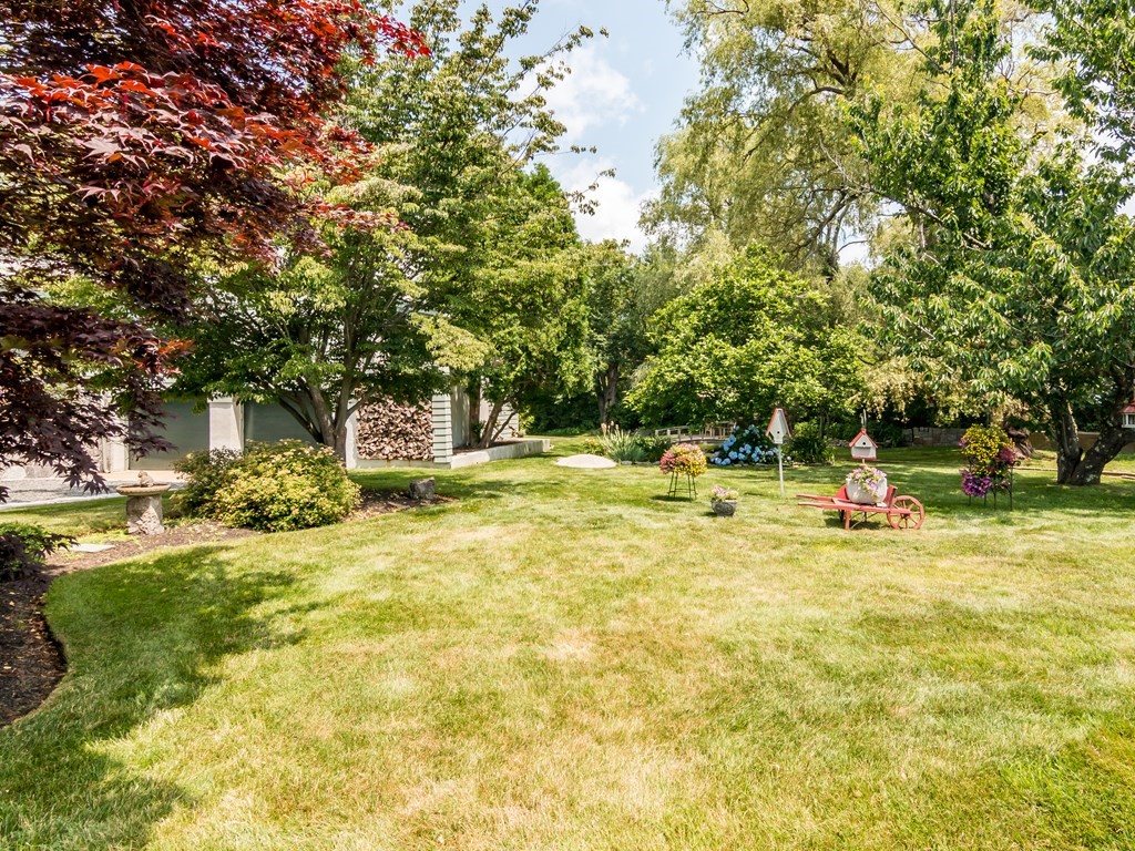 64 Grapevine Road Gloucester, MA 01930 - Photo 4 of 26 a view of a swimming pool with an outdoor space and seating area