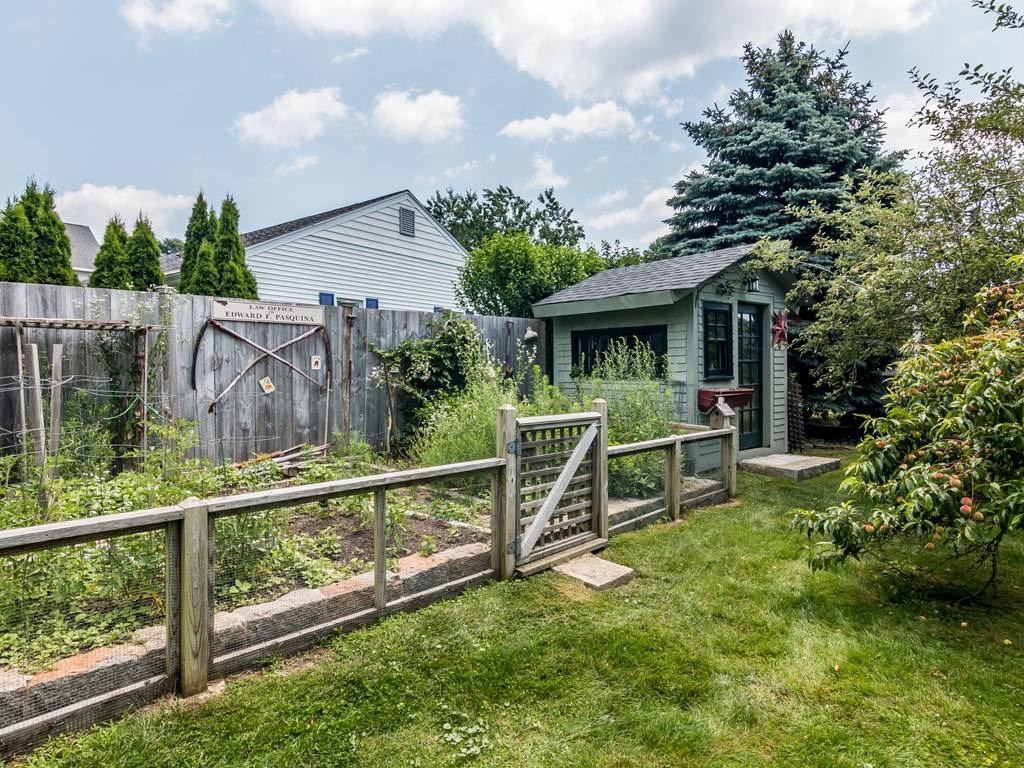 64 Grapevine Road Gloucester, MA 01930 - Photo 8 of 26 a view of a chair and table in backyard of the house