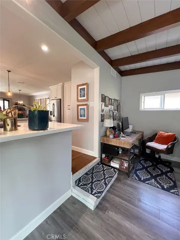 a workspace with furniture and wooden floor