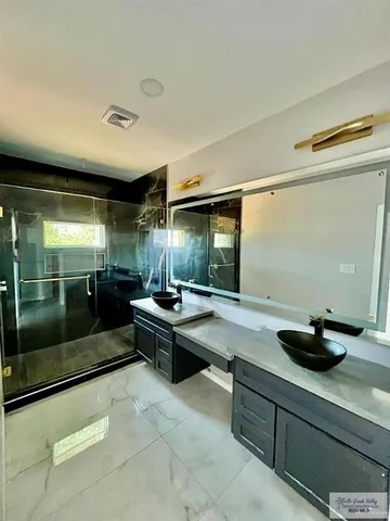 a kitchen with a sink and lots of counter space