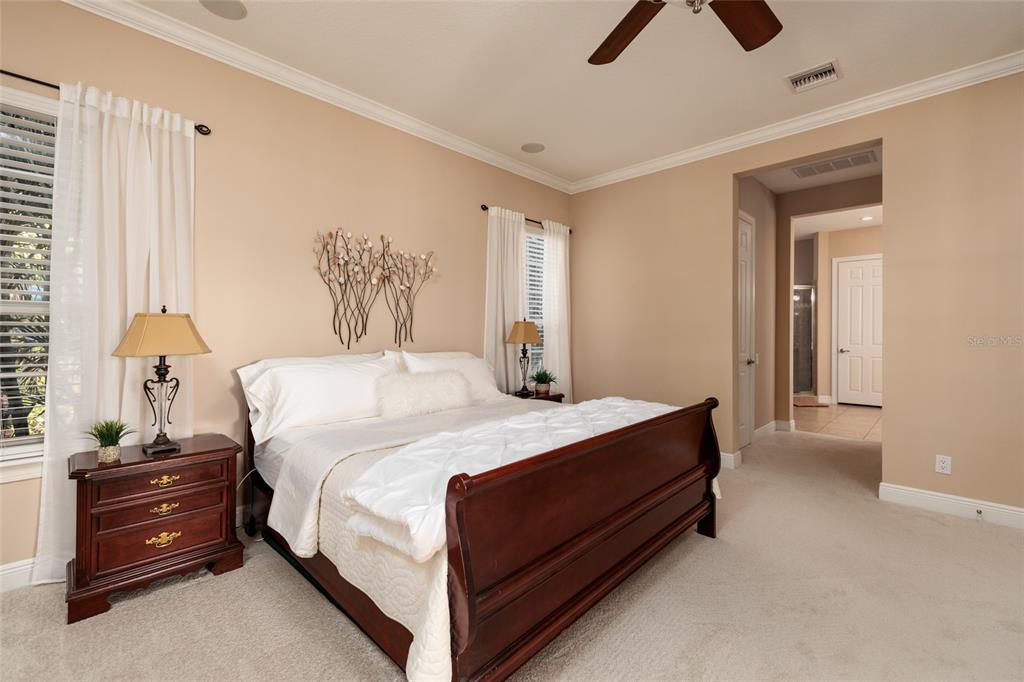 102 Wimbledon Court Redington Shores, FL 33708 - Photo 14 of 66 a bed room with a bed and a night stand