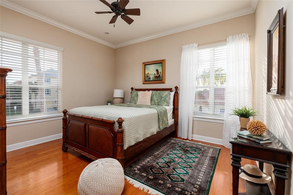102 Wimbledon Court Redington Shores, FL 33708 - Photo 20 of 66 a bedroom with a bed and a window