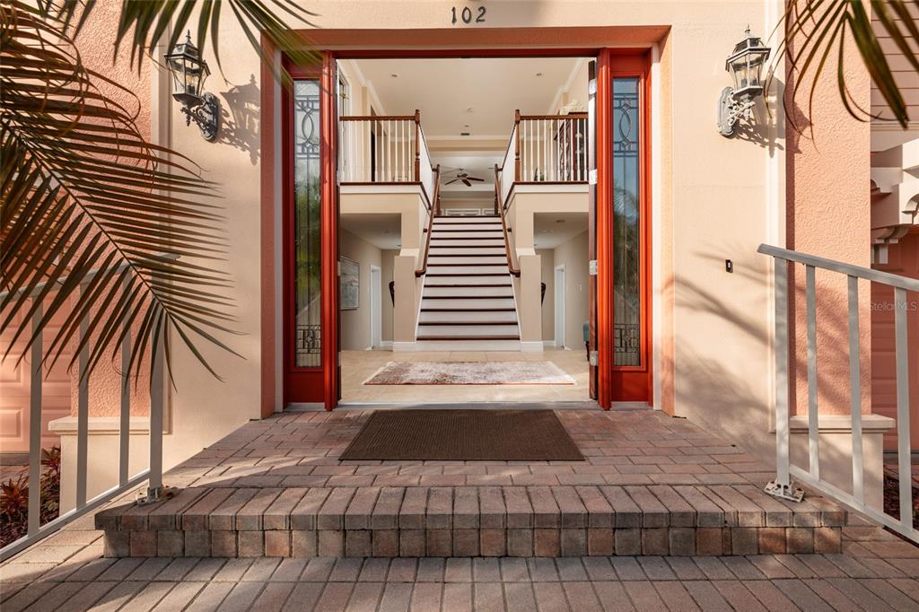 102 Wimbledon Court Redington Shores, FL 33708 - Photo 2 of 66 a view of a bedroom with wooden floor and fence