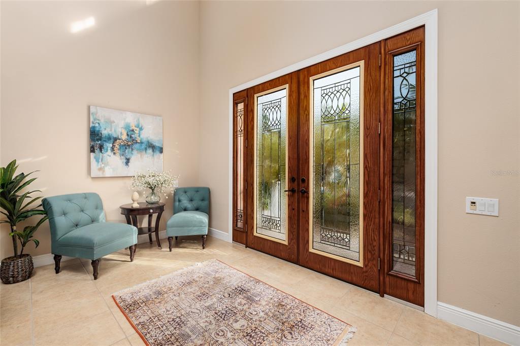 102 Wimbledon Court Redington Shores, FL 33708 - Photo 3 of 66 a living room with furniture and a window