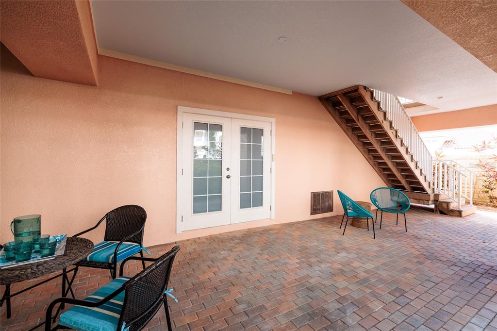 102 Wimbledon Court Redington Shores, FL 33708 - Photo 36 of 66 a view of a chairs in balcony