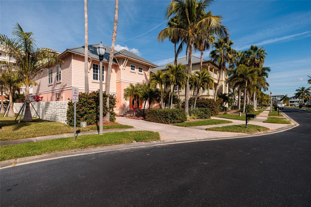 102 Wimbledon Court Redington Shores, FL 33708 - Photo 38 of 66 a view of a park with multi story residential apartment building in the background