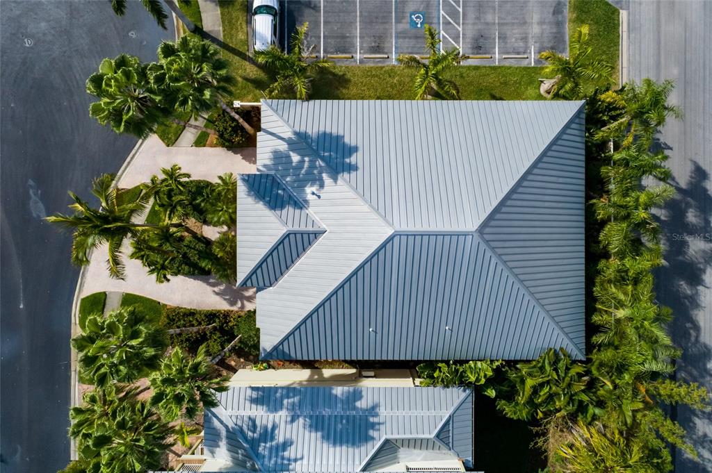 102 Wimbledon Court Redington Shores, FL 33708 - Photo 39 of 66 a view of a house with a flower garden