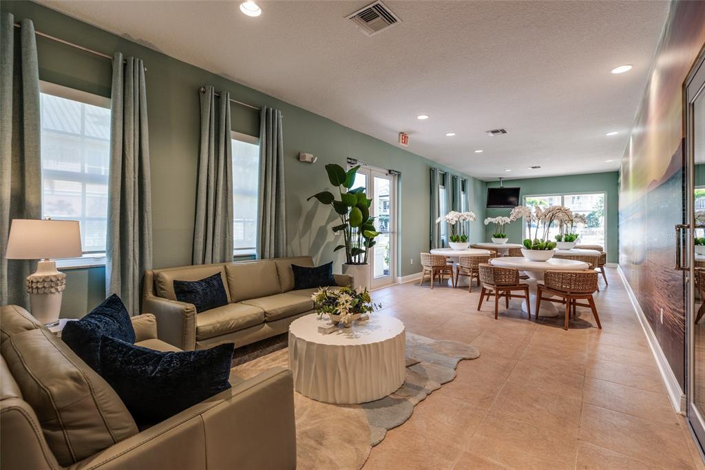 102 Wimbledon Court Redington Shores, FL 33708 - Photo 48 of 66 a living room with furniture and a large window