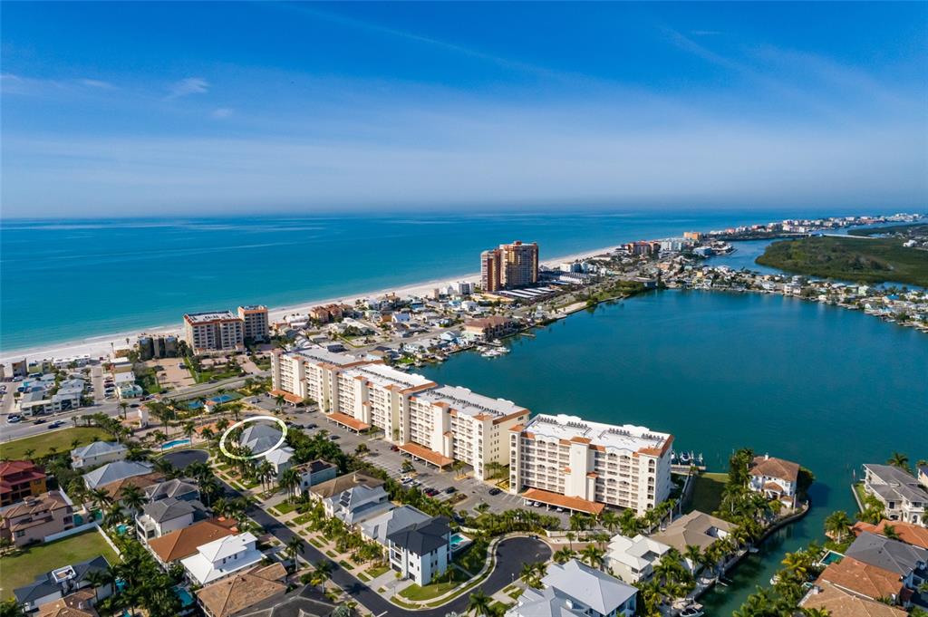 102 Wimbledon Court Redington Shores, FL 33708 - Photo 5 of 66 a view of a city with ocean