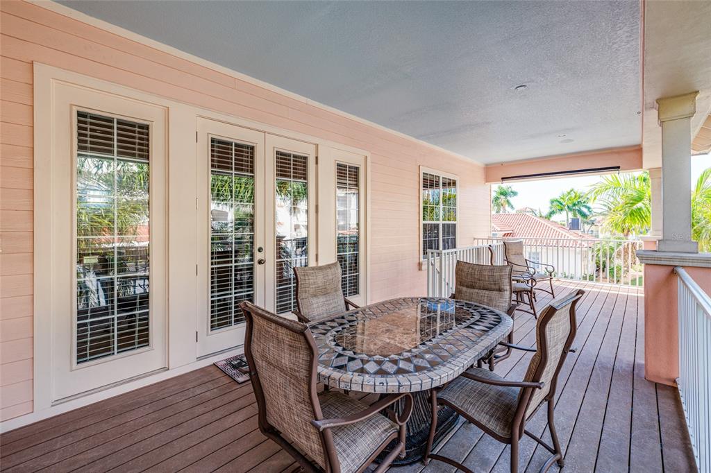 102 Wimbledon Court Redington Shores, FL 33708 - Photo 51 of 66 a dining room with furniture and wooden floor