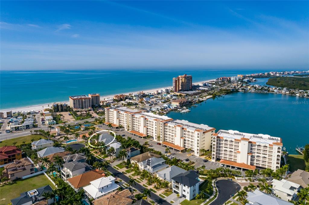 102 Wimbledon Court Redington Shores, FL 33708 - Photo 7 of 66 a view of a city and ocean view