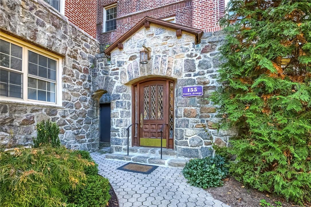 a front view of a house with yard