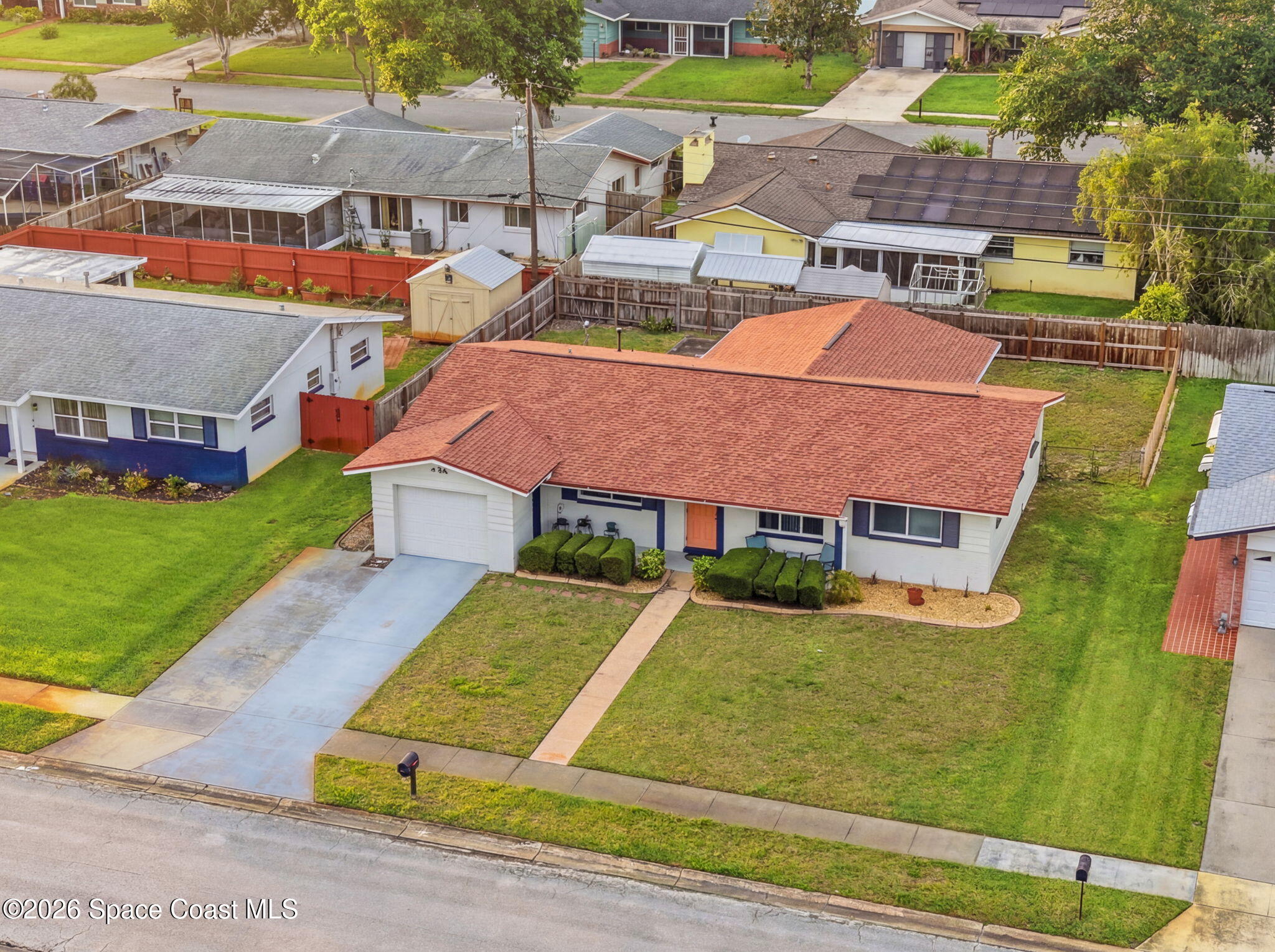 908 Jefferson Road Rockledge, FL 32955 - Photo 34 of 37 an aerial view of residential houses with yard and swimming pool