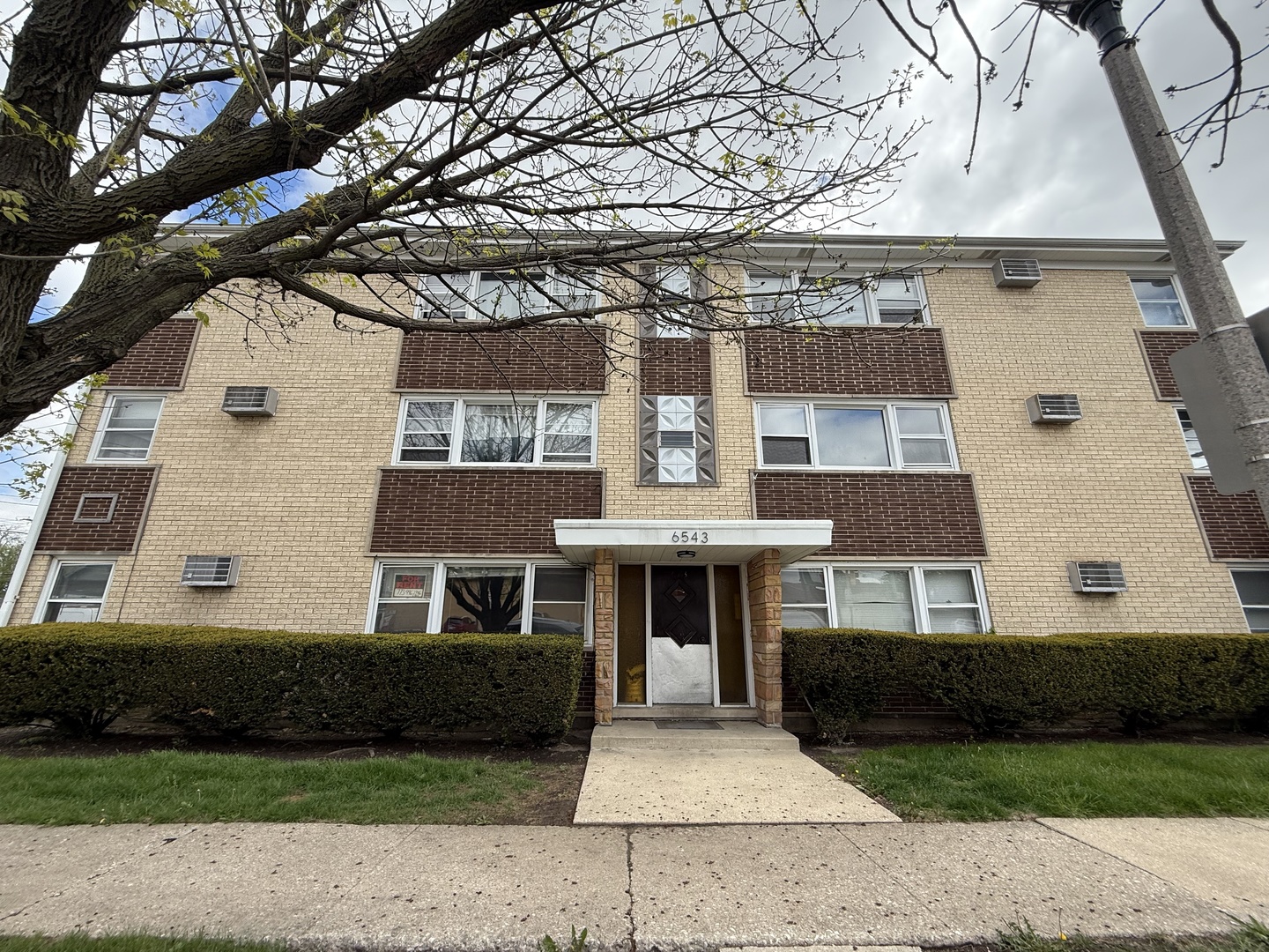 6543 16th Street, Unit 1N Berwyn, IL 60402 - Photo 1 of 11 a front view of a house with a yard
