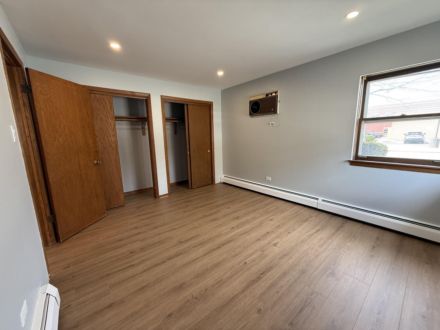 6543 16th Street, Unit 1N Berwyn, IL 60402 - Photo 10 of 11 an empty room with wooden floor and windows