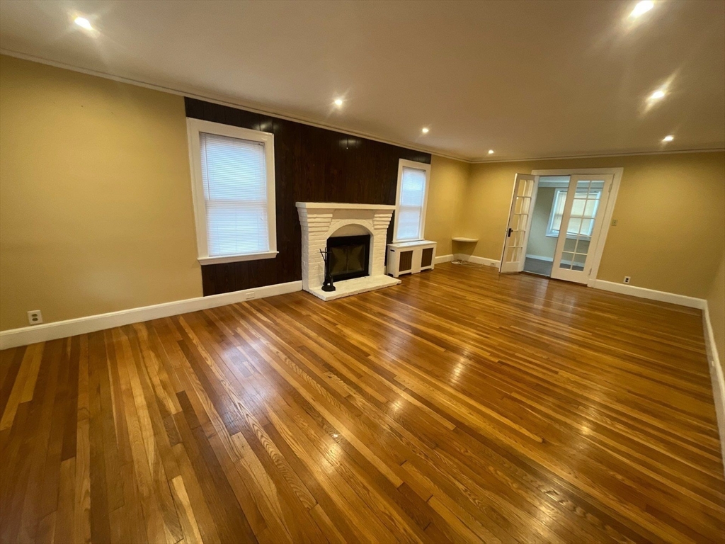 30 Stearns Road Belmont, MA 02478 - Photo 2 of 24 a view of an empty room with window and fire place