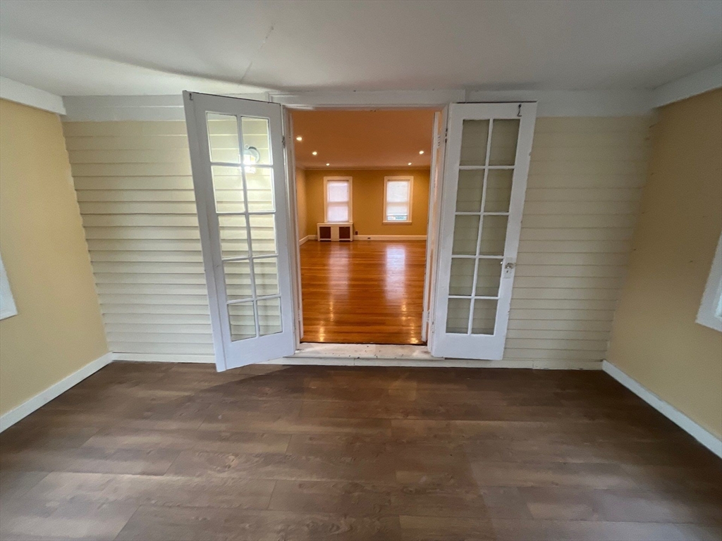30 Stearns Road Belmont, MA 02478 - Photo 5 of 24 an empty room with wooden floor and windows