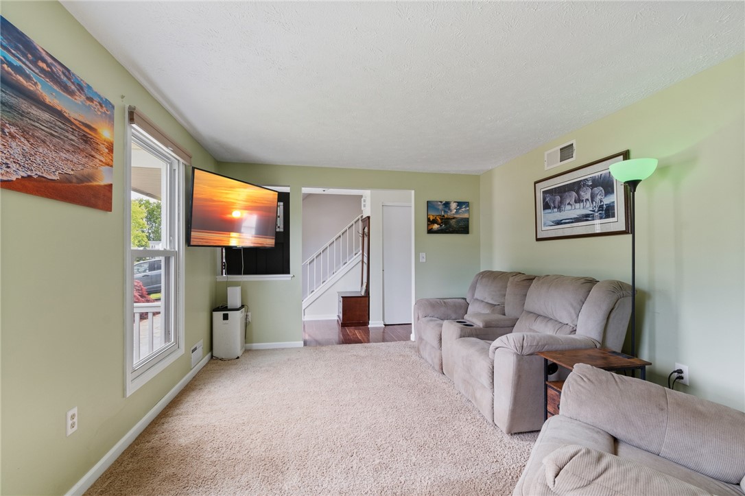 25 Spring Tree Lane Greece, NY 14612 - Photo 20 of 40 The front living room - the stairs to the second f