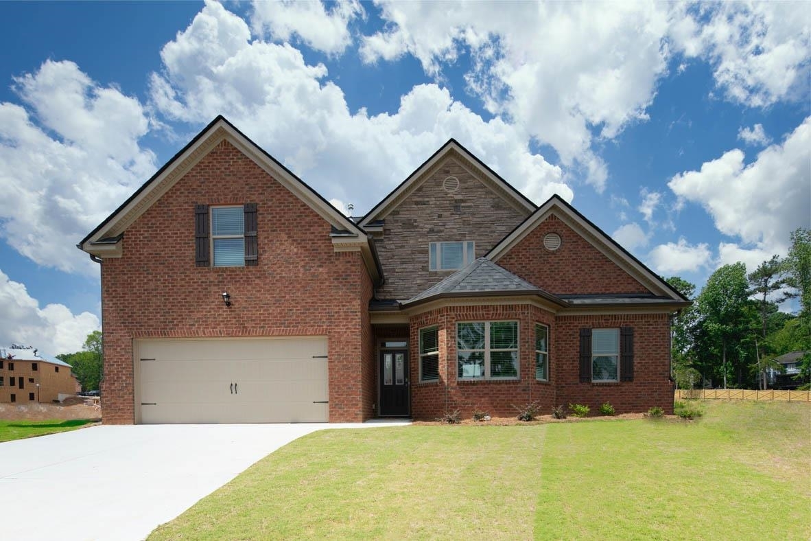 443 Beachview Road, Unit 34 Hampton, GA 30228 - Photo 1 of 1 a front view of a house with a yard