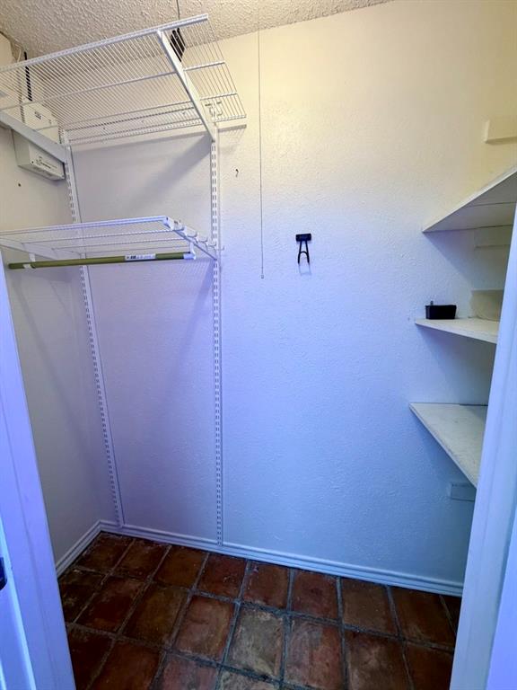 5045 Thunder Road Dallas, TX 75244 - Photo 26 of 28 a view of storage and utility room with racks on the wall