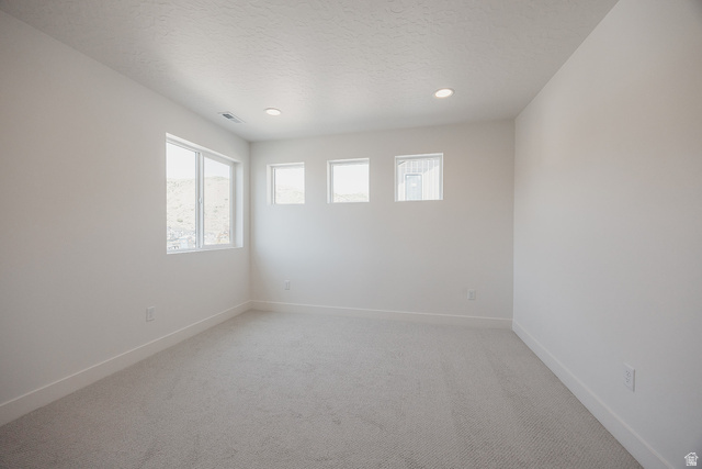 5902 Canyon Rim Road, Unit 620 Lehi, UT 84048 - Photo 56 of 78 Carpeted room featuring multiple windows, recessed lighting, white walls, and white baseboards