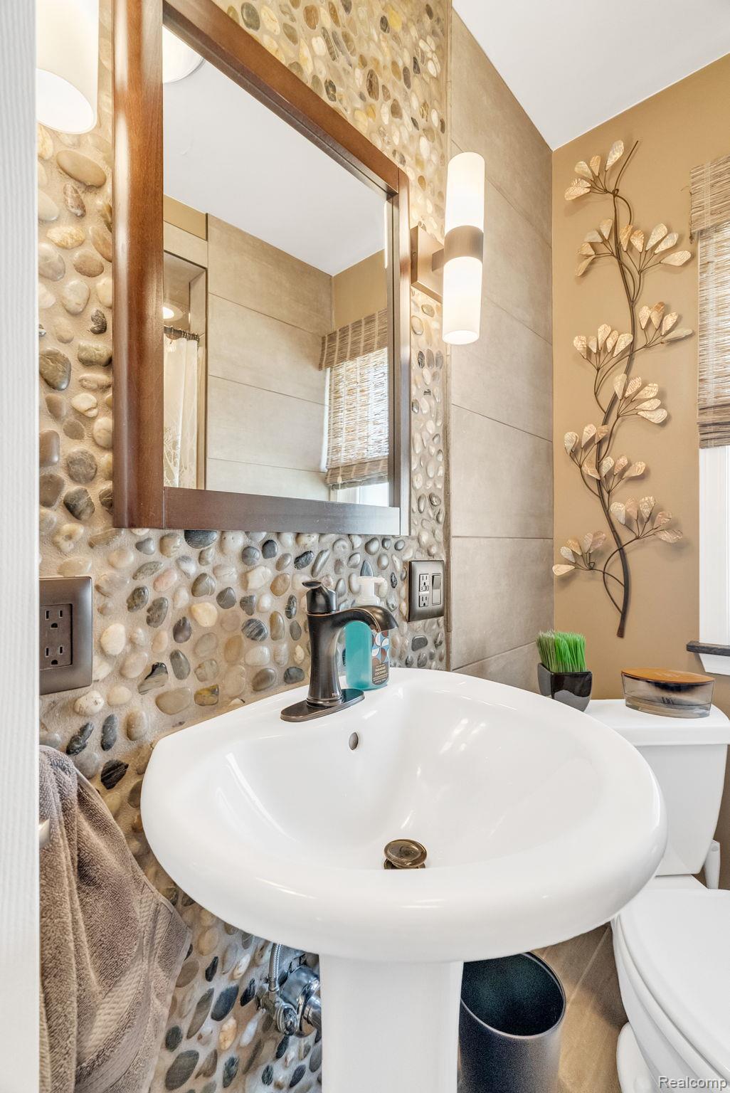 1020 Capac Road Allenton, MI 48002 - Photo 25 of 36 Bathroom with toilet and tile walls