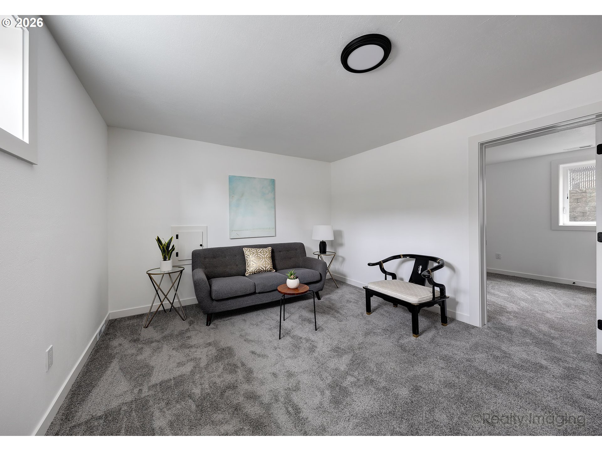 9004 Southeast Claybourne Street Portland, OR 97266 - Photo 11 of 15 a living room with furniture