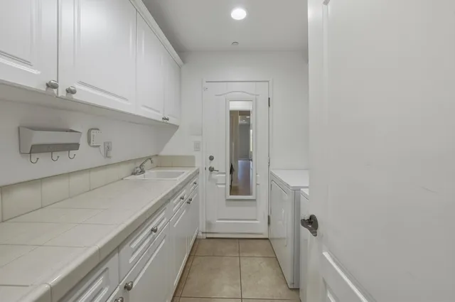 a bathroom with a sink a toilet and vanity