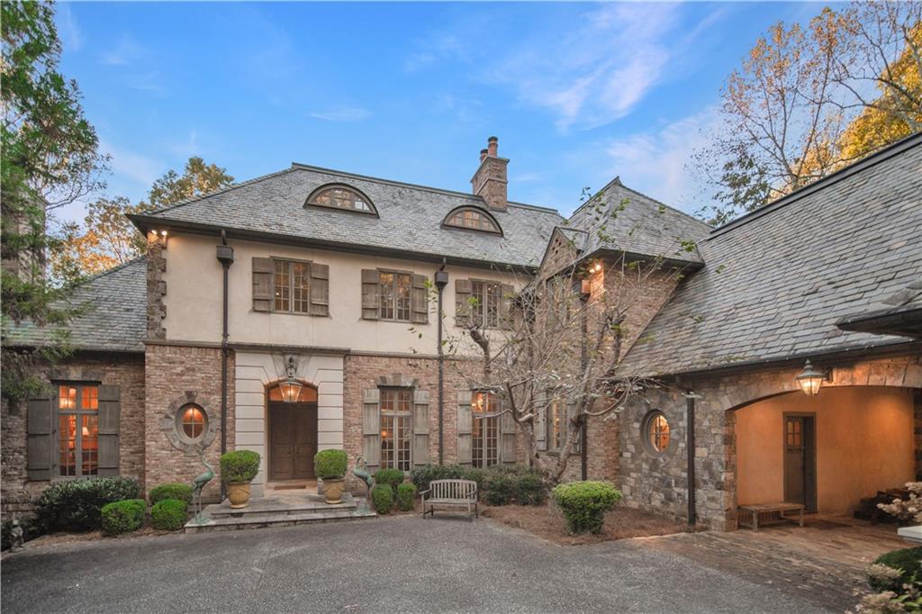 a front view of a house with parking area