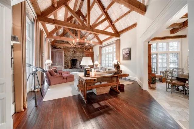 a living room with furniture a fireplace and city view