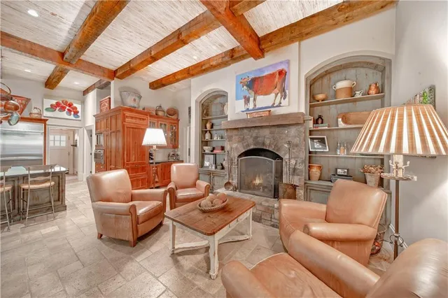 a living room with furniture rug and wooden floor