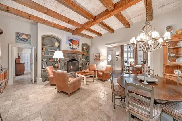 a view of a bedroom with furniture and a window