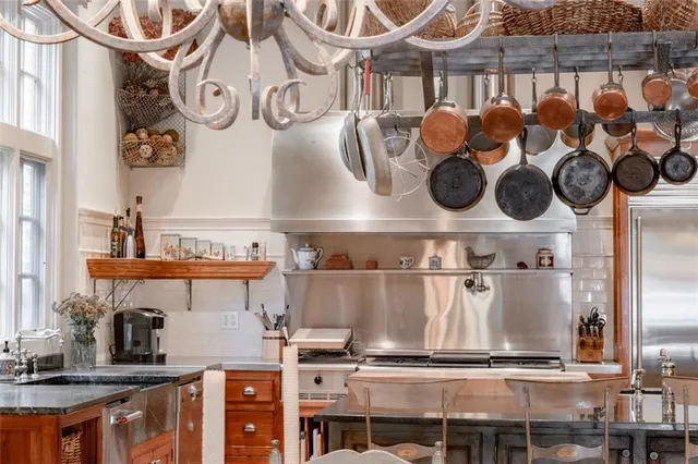 a spacious bathroom with a double vanity sink a mirror and a bathtub