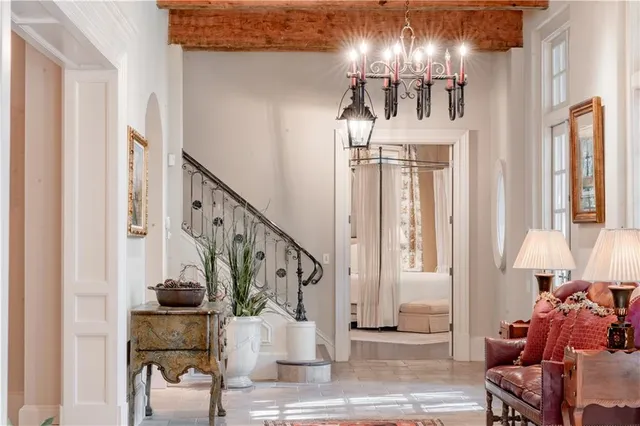 a living room with furniture and a book shelf