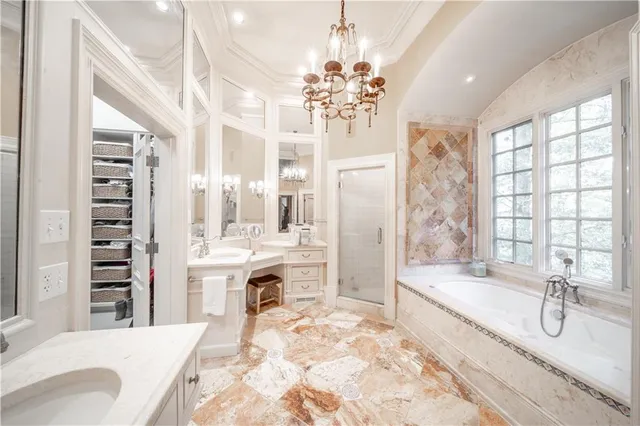 a bathroom with a granite countertop sink toilet a mirror a vanity and shower