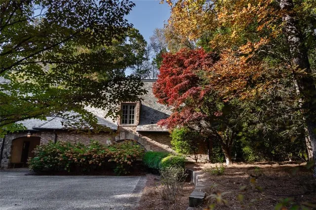 a view of a livingroom with furniture and a window