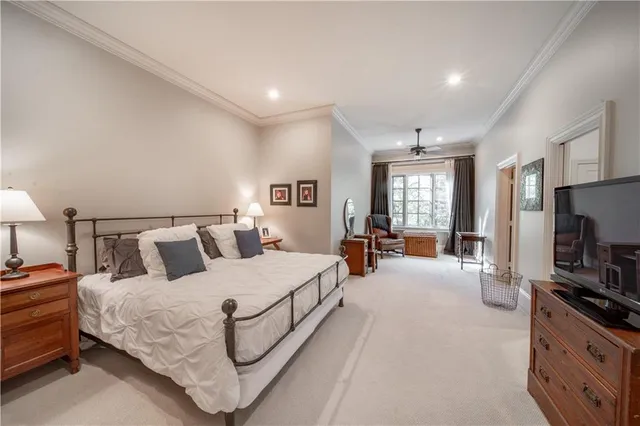 a front view of a house with a yard and fountain