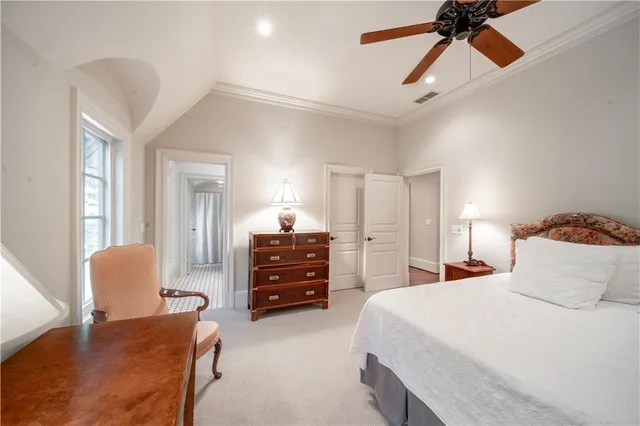a view of a room with wooden floor and chandelier