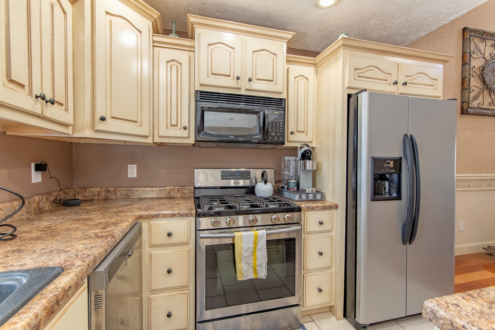 115 Tanyard Circle Adamsville, TN 38310 - Photo 15 of 52 a kitchen with granite countertop a refrigerator stove and sink