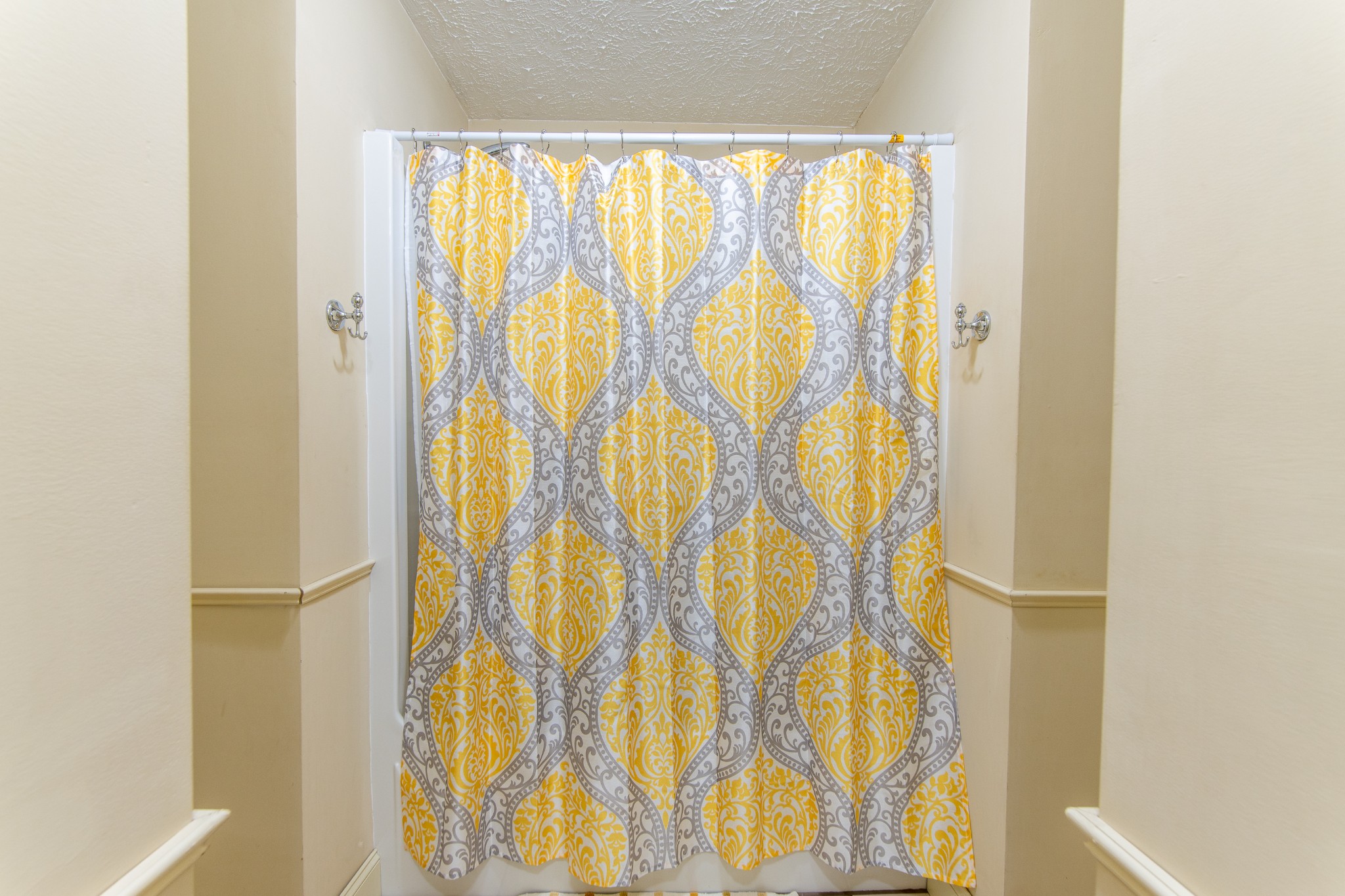 115 Tanyard Circle Adamsville, TN 38310 - Photo 26 of 52 a bathroom with a shower curtain and curtain