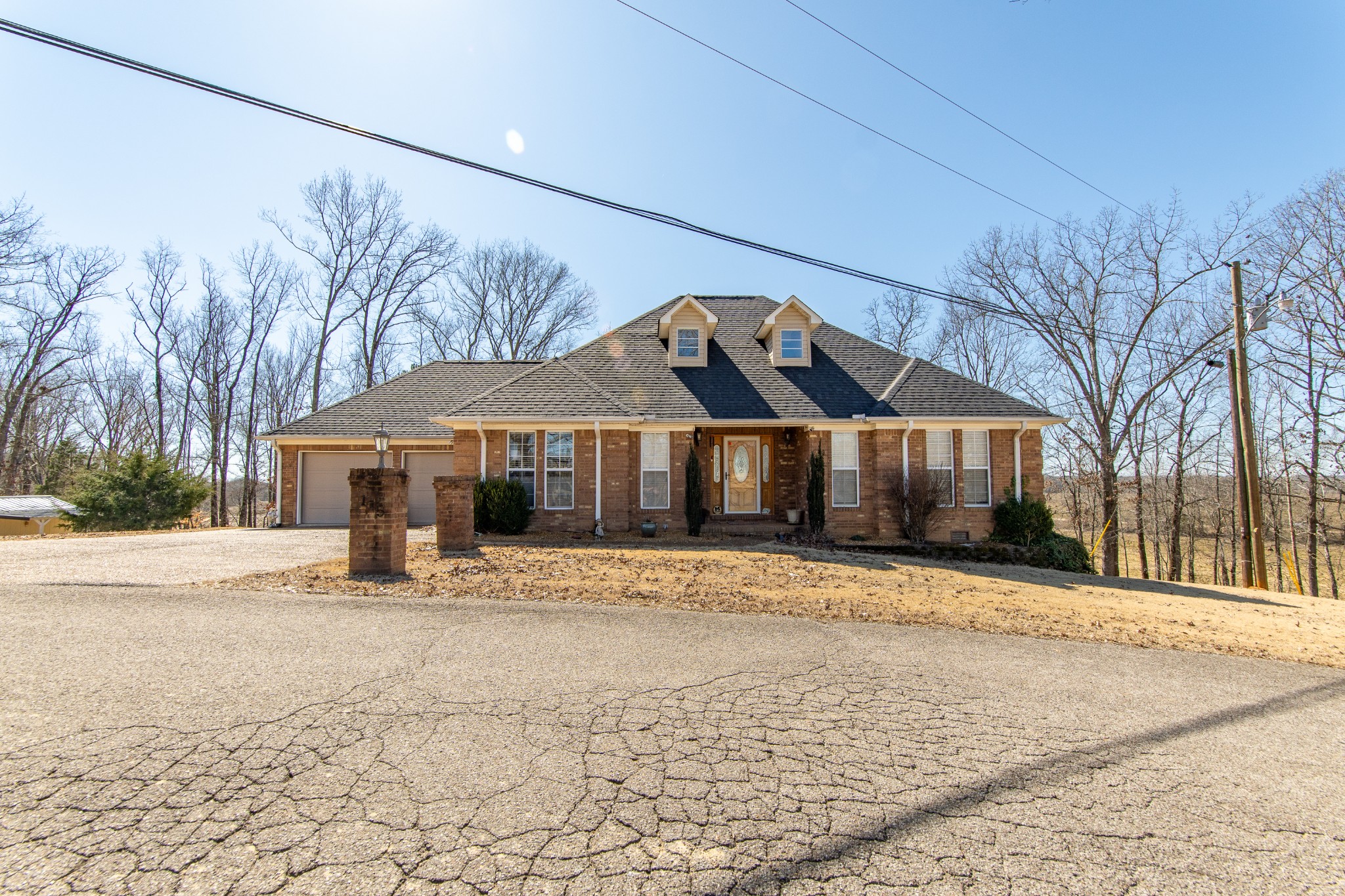 115 Tanyard Circle Adamsville, TN 38310 - Photo 52 of 52 a front view of a house with a yard and trees
