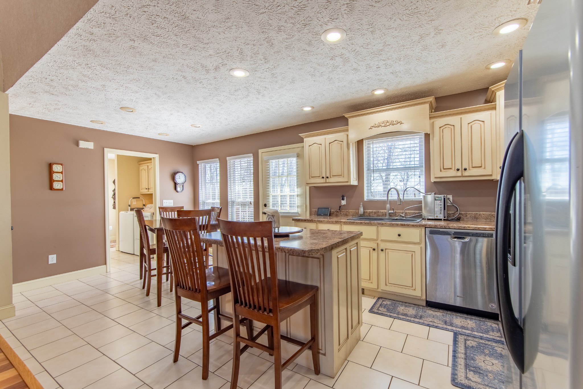 115 Tanyard Circle Adamsville, TN 38310 - Photo 9 of 52 a kitchen with stainless steel appliances granite countertop a table and chairs