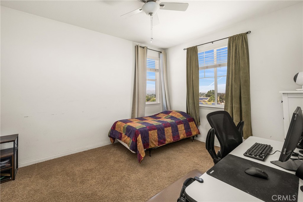 12652 Twin Peak Court Riverside, CA 92503 - Photo 35 of 55 a bedroom with a bed and a window