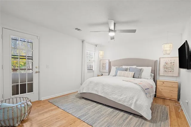 a bedroom with a large bed and a tv