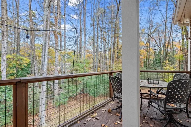 a view of a balcony with chairs