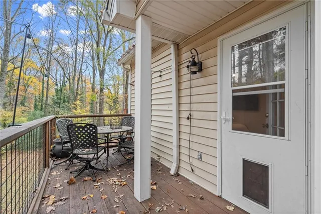 a view of a chair and table in the balcony