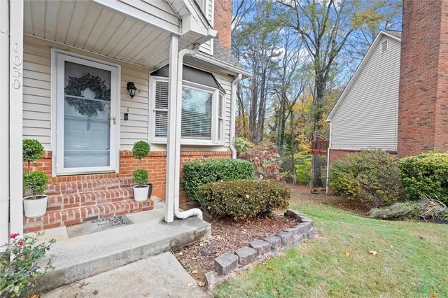 front view of a house with a large trees