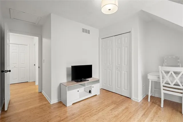 a room with furniture and flat screen tv