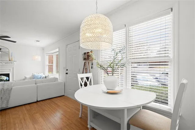 a living room with furniture a window and dining table