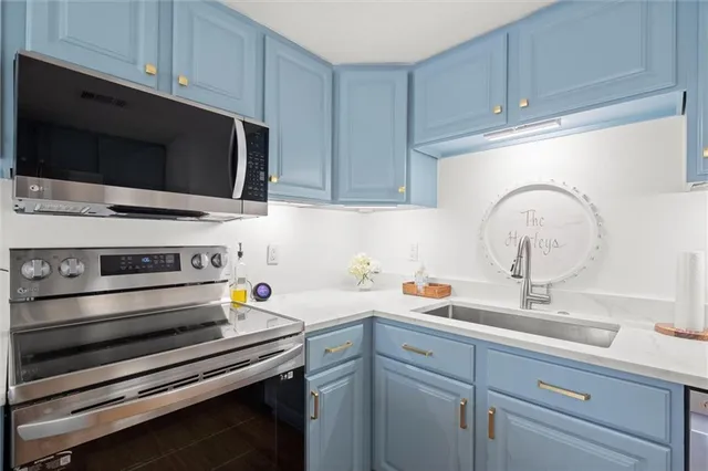 a kitchen with a stove and a microwave